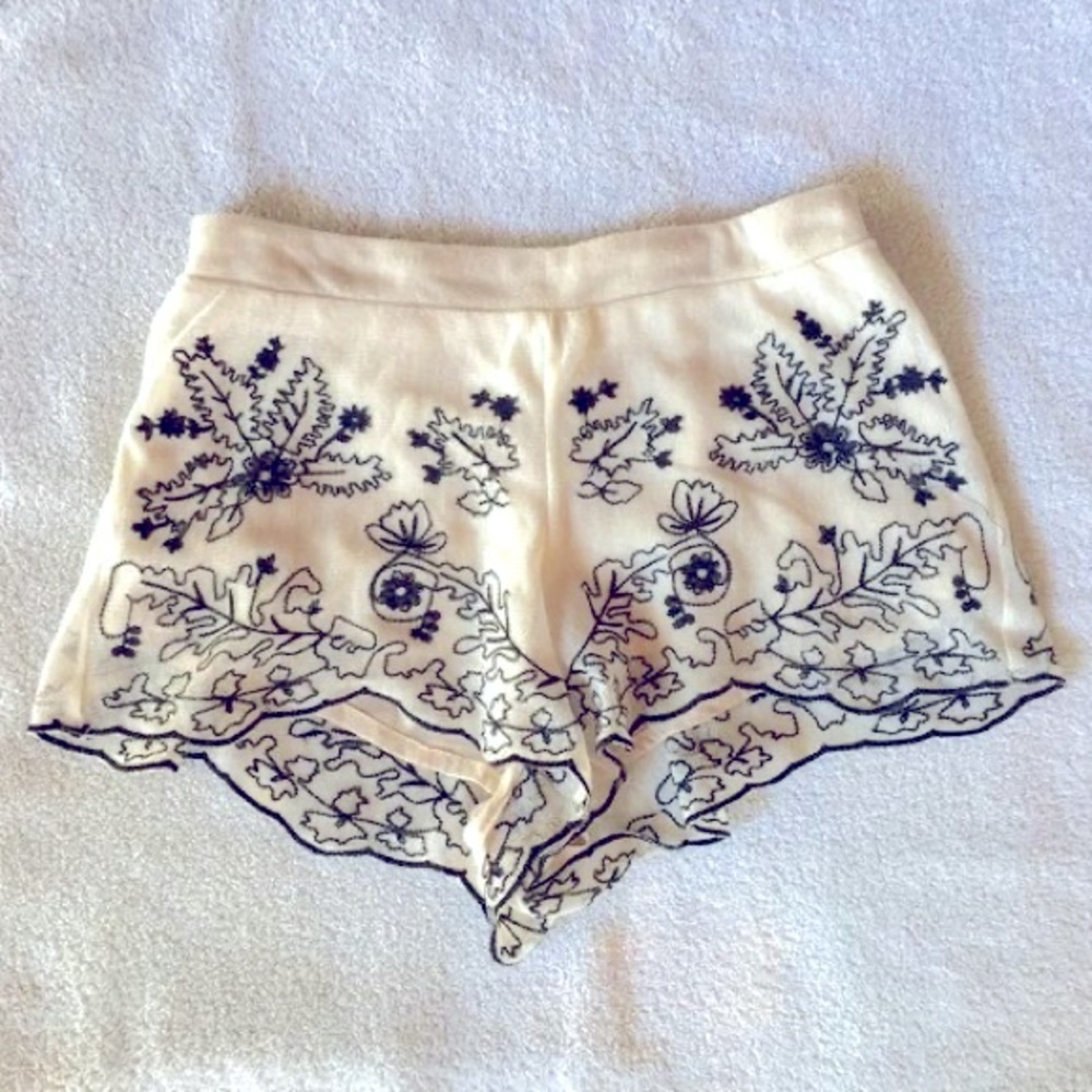 Cream with black detailing lace over fabric shorts size L